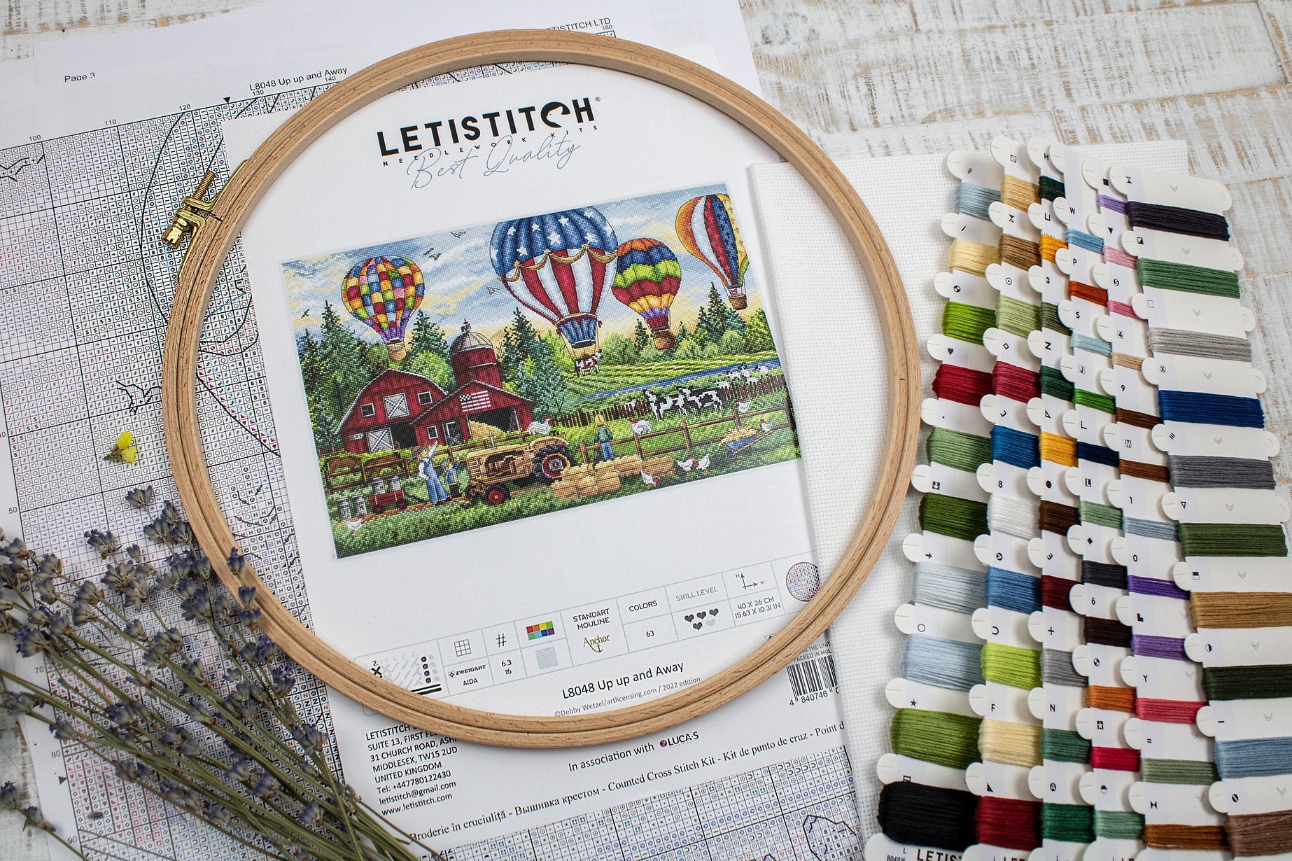 Up Up and Away L8048 Counted Cross Stitch Kit featuring colorful threads, Aida canvas, and detailed instruction chart.